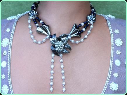 Black and pewter designer necklace with pewter flower centrepiece